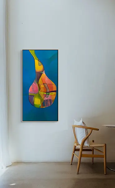 Colourful abstract hangs behind a wishbone chair