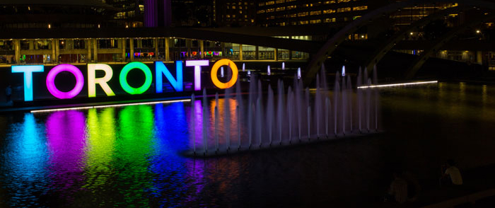 Toronto sign at City Hall lit up at night