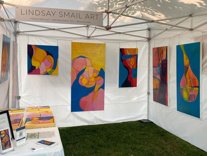 art fair tent with large abstract paintings