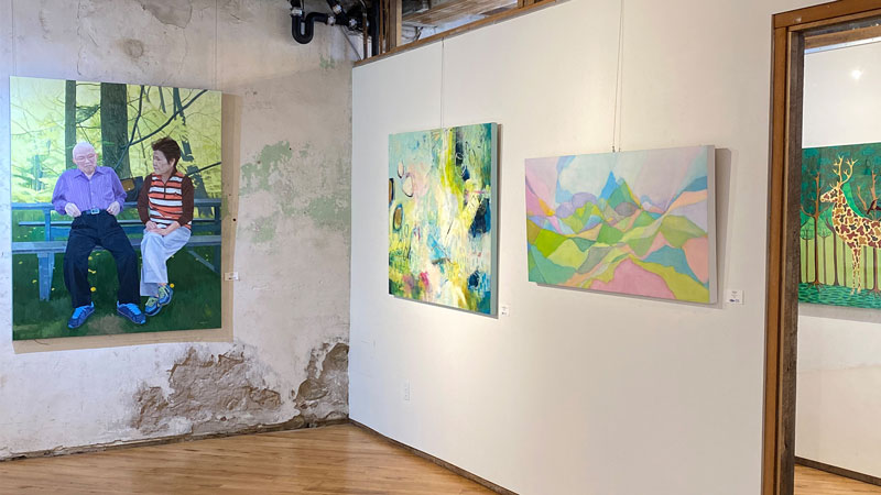 Paintings hanging in a gallery